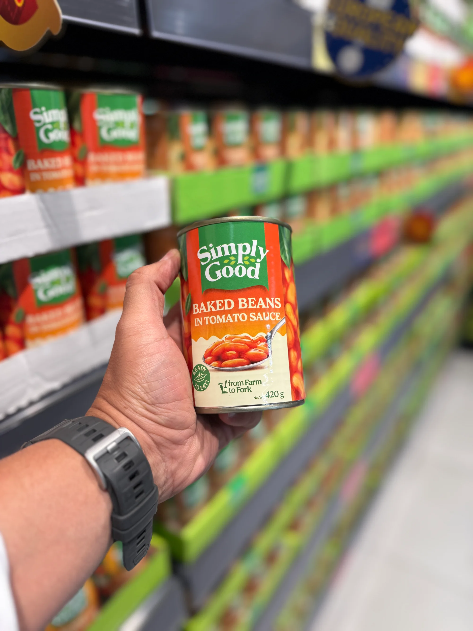 GCC merchandiser checking product placement and shelf availability